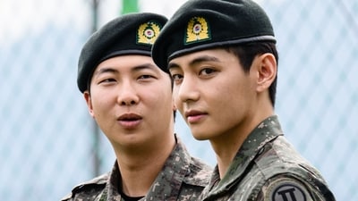 K-pop boy band BTS member V (R) looks on as RM reacts at an outdoor sporting facility in Chuncheon on June 10, 2025, after their release from 18 months of South Korean military service. Hundreds of fans gathered near two army bases just outside of the capital Seoul where band leader RM -- recently named "Favorite K-pop Artist" at the American Music Awards -- and singer V were discharged. (AFP) K-pop boy band BTS member V (R) looks on as RM reacts at an outdoor sporting facility in Chuncheon on June 10, 2025, after their release from 18 months of South Korean military service. Hundreds of fans gathered near two army bases just outside of the capital Seoul where band leader RM -- recently named "Favorite K-pop Artist" at the American Music Awards -- and singer V were discharged. (AFP)