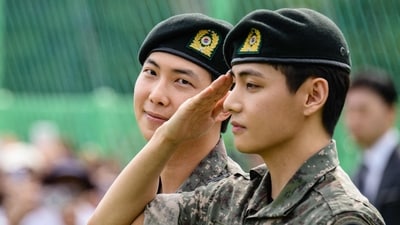 K-pop boy band BTS member V (R) salutes as RM looks on at an outdoor sporting facility in Chuncheon on June 10, 2025, after their release from 18 months of South Korean military service. Hundreds of fans gathered near two army bases just outside of the capital Seoul where band leader RM -- recently named "Favorite K-pop Artist" at the American Music Awards -- and singer V were discharged. (AFP) K-pop boy band BTS member V (R) salutes as RM looks on at an outdoor sporting facility in Chuncheon on June 10, 2025, after their release from 18 months of South Korean military service. Hundreds of fans gathered near two army bases just outside of the capital Seoul where band leader RM -- recently named "Favorite K-pop Artist" at the American Music Awards -- and singer V were discharged. (AFP)