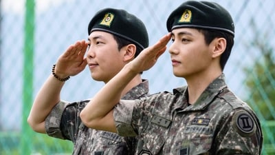 K-pop boy band BTS members RM (L) and V salute for fans and members of the press at an outdoor sporting facility in Chuncheon on June 10, 2025, after their release from 18 months of South Korean military service. Hundreds of fans gathered near two army bases just outside of the capital Seoul where band leader RM -- recently named "Favorite K-pop Artist" at the American Music Awards -- and singer V were discharged. (AFP) K-pop boy band BTS members RM (L) and V salute for fans and members of the press at an outdoor sporting facility in Chuncheon on June 10, 2025, after their release from 18 months of South Korean military service. Hundreds of fans gathered near two army bases just outside of the capital Seoul where band leader RM -- recently named "Favorite K-pop Artist" at the American Music Awards -- and singer V were discharged. (AFP)