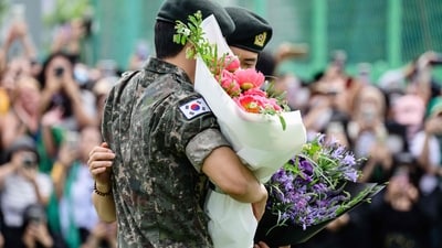 K-pop boy band BTS members RM (L) and V hug at an outdoor sporting facility in Chuncheon on June 10, 2025, after their release from 18 months of South Korean military service. Hundreds of fans gathered near two army bases just outside of the capital Seoul where band leader RM -- recently named "Favorite K-pop Artist" at the American Music Awards -- and singer V were discharged. (AFP) K-pop boy band BTS members RM (L) and V hug at an outdoor sporting facility in Chuncheon on June 10, 2025, after their release from 18 months of South Korean military service. Hundreds of fans gathered near two army bases just outside of the capital Seoul where band leader RM -- recently named "Favorite K-pop Artist" at the American Music Awards -- and singer V were discharged. (AFP)