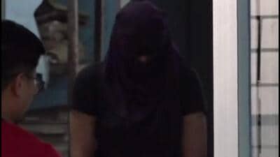 Sonam Raghuvanshi being brought to a police station in Patna on Tuesday. (PTI) Sonam Raghuvanshi being brought to a police station in Patna on Tuesday. (PTI)