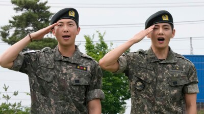 K-pop band BTS members RM, left, and V salute after being discharged from a mandatory military service in Chuncheon, South Korea, Tuesday, June 10, 2025. (AP) K-pop band BTS members RM, left, and V salute after being discharged from a mandatory military service in Chuncheon, South Korea, Tuesday, June 10, 2025. (AP)