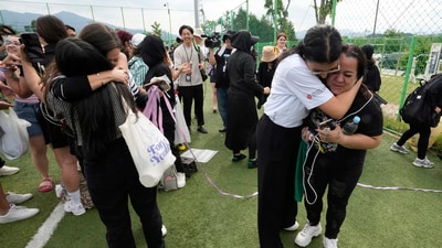 Fans react after K-pop band BTS members RM and V are discharged from a mandatory military service in Chuncheon, South Korea, Tuesday, June 10, 2025.(AP Photo/Ahn Young-joon) (AP) Fans react after K-pop band BTS members RM and V are discharged from a mandatory military service in Chuncheon, South Korea, Tuesday, June 10, 2025.(AP Photo/Ahn Young-joon) (AP)