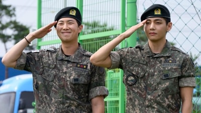 K-pop boy band BTS members RM (L) and V salute at an outdoor sporting facility in Chuncheon on June 10, 2025, after their release from 18 months of South Korean military service. Hundreds of fans gathered near two army bases just outside of the capital Seoul where band leader RM -- recently named "Favorite K-pop Artist" at the American Music Awards -- and singer V were discharged. (AFP) K-pop boy band BTS members RM (L) and V salute at an outdoor sporting facility in Chuncheon on June 10, 2025, after their release from 18 months of South Korean military service. Hundreds of fans gathered near two army bases just outside of the capital Seoul where band leader RM -- recently named "Favorite K-pop Artist" at the American Music Awards -- and singer V were discharged. (AFP)