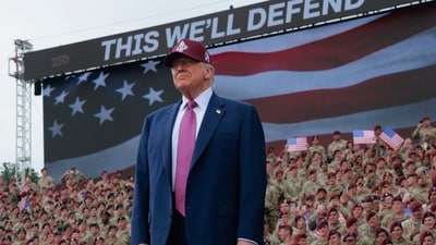 President Donald Trump takes the stage during a rally with US Army troops on Tuesday at Fort Bragg, North Carolina. (Getty Images via AFP) President Donald Trump takes the stage during a rally with US Army troops on Tuesday at Fort Bragg, North Carolina. (Getty Images via AFP)