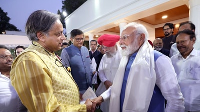 Prime Minister Narendra Modi exchanges handshake with Congress MP Shashi Tharoor as he hosts delegation members who went to various countries for Operation Sindoor global outreach. (PMO)