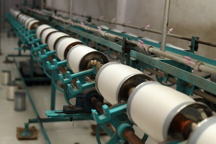Cotton yarn being spun on machine (Fabindia)