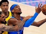 Oklahoma City Thunder guard Shai Gilgeous-Alexander (2) shoots the ball against Indiana Pacers forward Obi Toppin (1)