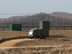 A South Korean military vehicle with loudspeakers is seen in front of the barbed-wire fence in Paju, near the border with North Korea, on Feb. 15, 2018.