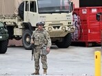 A member of the California National Guard stands guard outside federal buildings in Los Angeles.