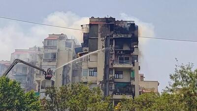 Firefighters try to douse the blaze on a building at Shabad Aparment in Dwarka’s Sector 13 on Tuesday. (VIPIN KUMAR/HT) Firefighters try to douse the blaze on a building at Shabad Aparment in Dwarka’s Sector 13 on Tuesday. (VIPIN KUMAR/HT)