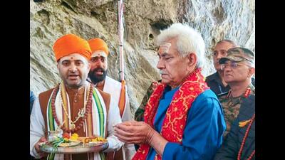 Jammu and Kashmir lieutenant governor Manoj Sinha performs 'Pratham Puja,' at the Amarnath shrine, in Anantnag on Wednesday. (ANI) Jammu and Kashmir lieutenant governor Manoj Sinha performs 'Pratham Puja,' at the Amarnath shrine, in Anantnag on Wednesday. (ANI)