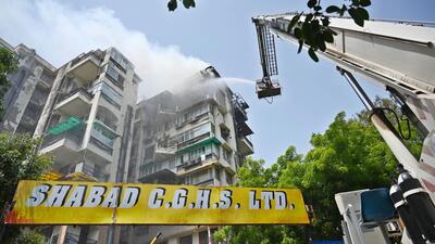 New Firefighters try to douse the blaze at an apartment complex in Dwarka on Tuesday. (VIPIN KUMAR/HT PHOTO) New Firefighters try to douse the blaze at an apartment complex in Dwarka on Tuesday. (VIPIN KUMAR/HT PHOTO)