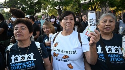 A woman holds a candle with the words ‘Immigrants are the Light’ during a prayer vigil before curfew goes in effect following days of protests in Los Angeles on June 10, 2025. (AFP) A woman holds a candle with the words ‘Immigrants are the Light’ during a prayer vigil before curfew goes in effect following days of protests in Los Angeles on June 10, 2025. (AFP)