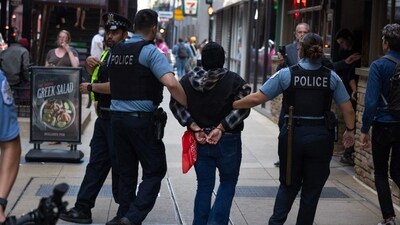 Protesters, including immigration rights and pro-Palestinian activists, united to demand an end to ICE raids, chanting solidarity slogans during the march. (Photo by SCOTT OLSON / GETTY IMAGES NORTH AMERICA / Getty Images via AFP) (Getty Images via AFP) Protesters, including immigration rights and pro-Palestinian activists, united to demand an end to ICE raids, chanting solidarity slogans during the march. (Photo by SCOTT OLSON / GETTY IMAGES NORTH AMERICA / Getty Images via AFP) (Getty Images via AFP)