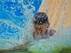 A child at a water park in the city as the maximum temperature touched 43.9°C on Thursday. (Sanchit Khanna/HT Photo) A child at a water park in the city as the maximum temperature touched 43.9°C on Thursday. (Sanchit Khanna/HT Photo)