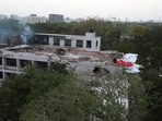 A tail of an Air India Boeing 787 Dreamliner plane that crashed is seen stuck on a building after the incident in Ahmedabad, India, June 12, 2025.