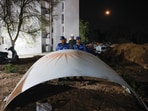 Ahmedabad plane crash: Security personnel stand next to the wreckage of the Air India flight which crashed minutes after take off