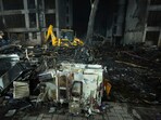 Search and recovery teams work through the rubble of a plane crash in Ahmedabad. Search and recovery teams work through the rubble of a plane crash in Ahmedabad.