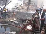 Emergency personnel work at the crash site of an Air India plane in Ahmedabad, June 12,.
