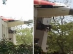 The visuals shows part of the plane's fuselage piercing a building.