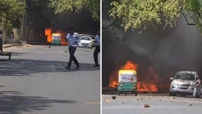 Locals run from fire and smoke from an Air India plane crash in Ahmedabad. (X/@PTI_News)