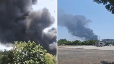Thick black smoke at Ahmedabad plane crash site. (Screengrab) Thick black smoke at Ahmedabad plane crash site. (Screengrab)