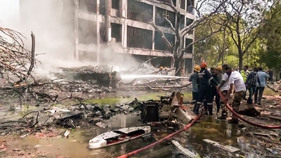 Firefighting operation underway at the site where an Air India plane, B787 Aircraft VT-ANB, while operating flight AI-171 from Ahmedabad to Gatwick, has crashed immediately after takeoff with 242 passengers onboard, in Ahmedabad on Thursday. (ANI)