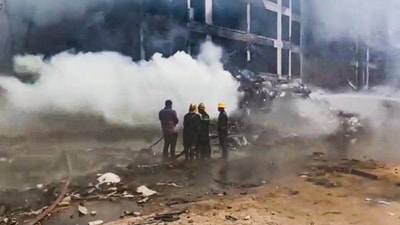 Firefighting team at the spot after an Air India plane crashed in Meghaninagar area, near Ahmedabad airport, Thursday, June 12, 2025. (PTI) Firefighting team at the spot after an Air India plane crashed in Meghaninagar area, near Ahmedabad airport, Thursday, June 12, 2025. (PTI)