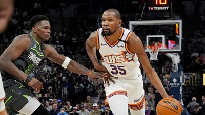 Phoenix Suns forward Kevin Durant (35) brings the ball up as Minnesota Timberwolves guard Anthony Edwards (5) defends him in the fourth quarter (IMAGN IMAGES via Reuters Connect)