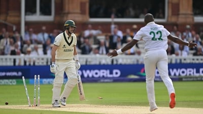 Lungi Ngidi celebrates after bowling Pat Cummins. Ngidi's fiery post-tea spell cracked the game wide open, as he took three wickets, including those of Steven Smith and Beau Webster. A much better performance from him as compared to the first innings. (AFP) Lungi Ngidi celebrates after bowling Pat Cummins. Ngidi's fiery post-tea spell cracked the game wide open, as he took three wickets, including those of Steven Smith and Beau Webster. A much better performance from him as compared to the first innings. (AFP)