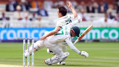 Pat Cummins crashes into Kyle Verreynne of South Africa mid-appeal. Cummins would take the DRS review for this ball, with the wicketkeeper judged out on review. (Action Images via Reuters)