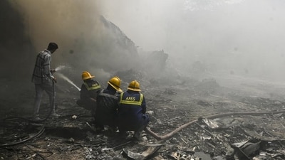 Fire and Emergency Services personnel at work following the Air India plane crash in Ahmedabad, on Thursday. (PTI) Fire and Emergency Services personnel at work following the Air India plane crash in Ahmedabad, on Thursday. (PTI)