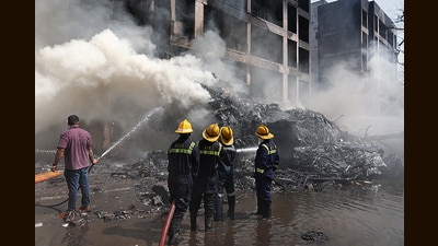 Firefighters douse the fire at in Ahmedabad on Thursday. (Reuters) Firefighters douse the fire at in Ahmedabad on Thursday. (Reuters)