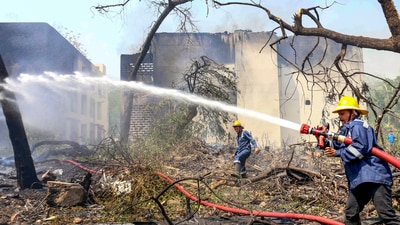 Firefighting team at the spot after a London-bound Air India plane crashed moments after taking off from the Ahmedabad airport. (PTI) Firefighting team at the spot after a London-bound Air India plane crashed moments after taking off from the Ahmedabad airport. (PTI)