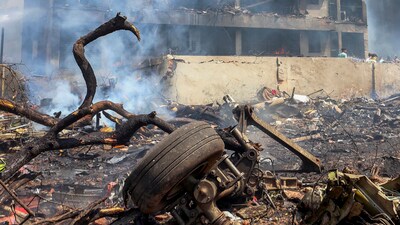 Visuals from the area showed mangled metal of the wreckage, snarls of tangled wire and smoke rising from the charred remnants. (PTI) Visuals from the area showed mangled metal of the wreckage, snarls of tangled wire and smoke rising from the charred remnants. (PTI)