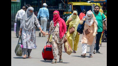 People cover themselves to get protection against the scorching sun during a hot summer day in Varanasi on Thursday (PTI) People cover themselves to get protection against the scorching sun during a hot summer day in Varanasi on Thursday (PTI)