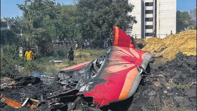People near the debris of the Air India plane that crashed moments after taking off from the airport, in Ahmedabad, on Thursday. (PTI) People near the debris of the Air India plane that crashed moments after taking off from the airport, in Ahmedabad, on Thursday. (PTI)
