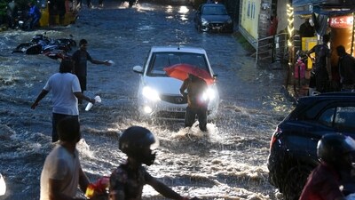 People wade through the waterlogged street amid heavy rainfall, at Malakpet, in Hyderabad on July 24, 2023. (ANI) People wade through the waterlogged street amid heavy rainfall, at Malakpet, in Hyderabad on July 24, 2023. (ANI)