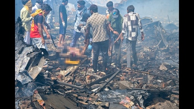 The scene of the plane crash near the Ahmedabad airport. (PTI) The scene of the plane crash near the Ahmedabad airport. (PTI)
