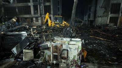 Search and recovery teams work through the rubble of a plane crash in Ahmedabad. (AP) Search and recovery teams work through the rubble of a plane crash in Ahmedabad. (AP)