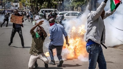 Protesters react to a teargas canister exploding next to them as clashes erupt between demonstrators and police during a protest over the death of Kenyan blogger Albert Ojwang, who died in police custody (AFP) Protesters react to a teargas canister exploding next to them as clashes erupt between demonstrators and police during a protest over the death of Kenyan blogger Albert Ojwang, who died in police custody (AFP)