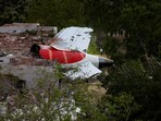 A tail of an Air India Boeing 787 Dreamliner plane that crashed is seen stuck on a building after the incident in Ahmedabad, India, June 12, 2025.
