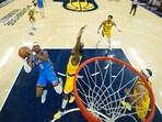 Shai Gilgeous-Alexander shoots over Aaron Nesmith in NBA Finals game 3.