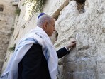 Prime Minister Benjamin Netanyahu was photographed on Thursday putting a handwritten note into a crack of Jerusalem's Western Wall, Judaism's holiest prayer site.