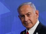 Israeli Prime Minister Benjamin Netanyahu walks after a press conference.