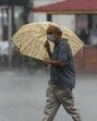 Mumbai, India - Aug. 11, 2020:A man walk with umbrella as it rain at Dadar in Mumbai, India, on Tuesday, August 11, 2020. (Photo by Satish Bate/Hindustan Times) (Satish Bate/HT Photo) Mumbai, India - Aug. 11, 2020:A man walk with umbrella as it rain at Dadar in Mumbai, India, on Tuesday, August 11, 2020. (Photo by Satish Bate/Hindustan Times) (Satish Bate/HT Photo)