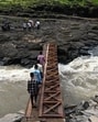 Palghar, India- September 14, 2024: Near Sawarde village in Palghar district, people are risking their lives by crossing a bridge over the Vaitarna River. In the last three years, eight people have been swept away in the water due to the sudden release of water from the middle Vaitarna dam while crossing the bridge over the Vaitarna River in Sawarde village in Palghar district. Palghar, India, September 14, 2024. (Photo by Raju Shinde/HT Photo) (Hindustan Times) Palghar, India- September 14, 2024: Near Sawarde village in Palghar district, people are risking their lives by crossing a bridge over the Vaitarna River. In the last three years, eight people have been swept away in the water due to the sudden release of water from the middle Vaitarna dam while crossing the bridge over the Vaitarna River in Sawarde village in Palghar district. Palghar, India, September 14, 2024. (Photo by Raju Shinde/HT Photo) (Hindustan Times)