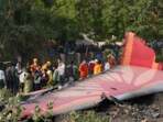 People near the debris of the Air India plane that crashed moments after taking off from the Sardar Vallabhbhai Patel international airport, in Ahmedabad, on Thursday. People near the debris of the Air India plane that crashed moments after taking off from the Sardar Vallabhbhai Patel international airport, in Ahmedabad, on Thursday.