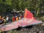 People near the debris of the Air India plane that crashed moments after taking off from the Sardar Vallabhbhai Patel international airport, in Ahmedabad, on Thursday. People near the debris of the Air India plane that crashed moments after taking off from the Sardar Vallabhbhai Patel international airport, in Ahmedabad, on Thursday.